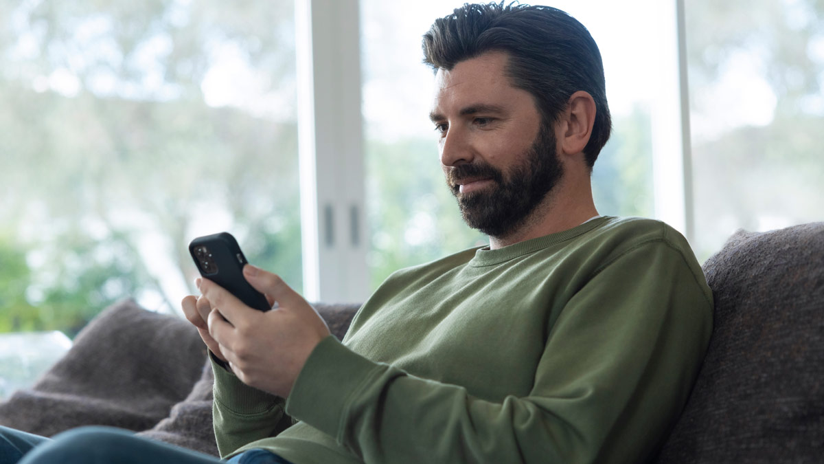 relaxing while checking a smartphone
