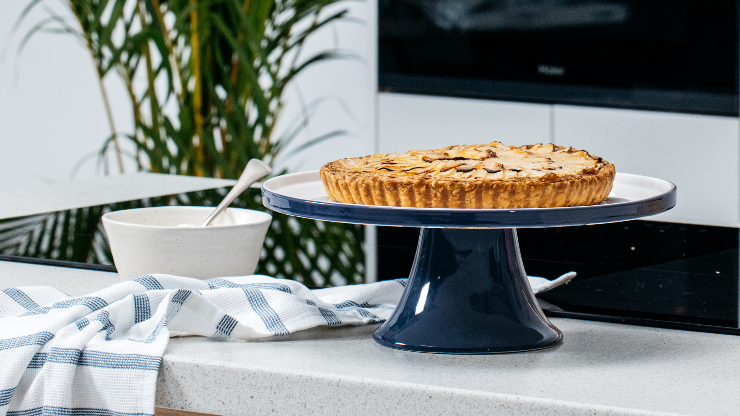 cooked apple tart sitting on a serving platter