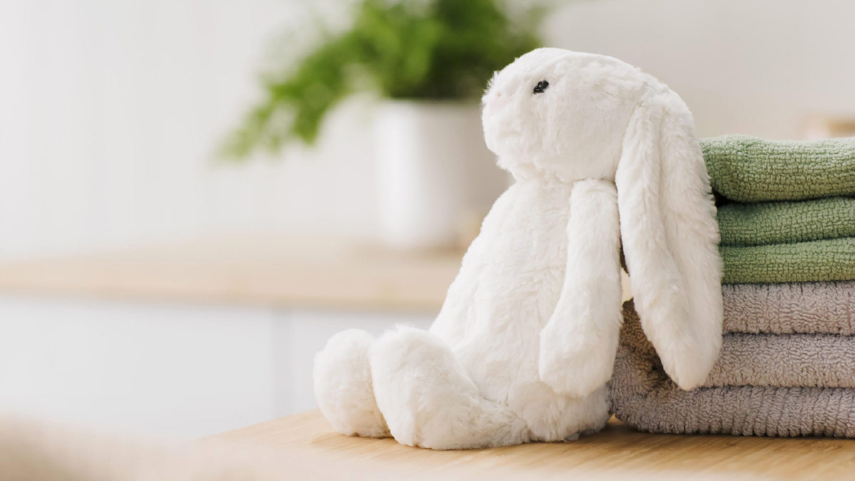 a soft toy bunny and towels