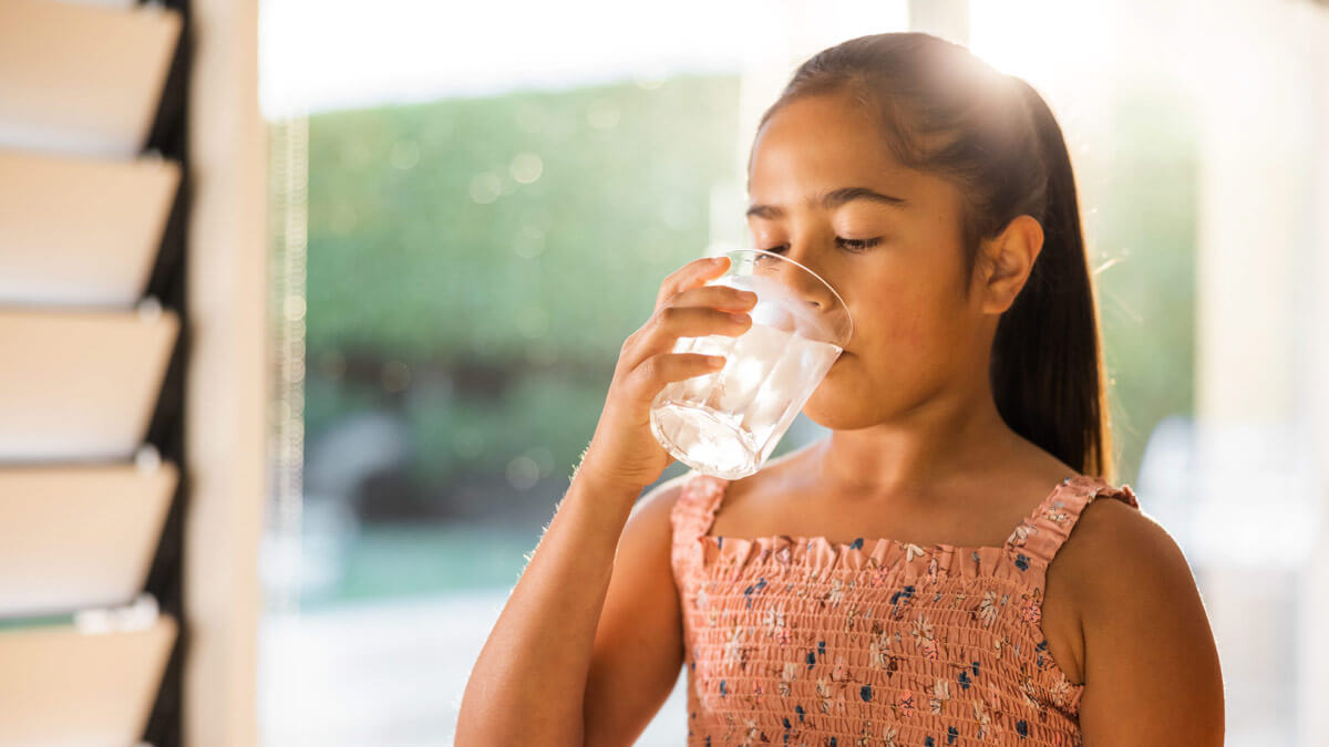 Girl drinking a glass of water