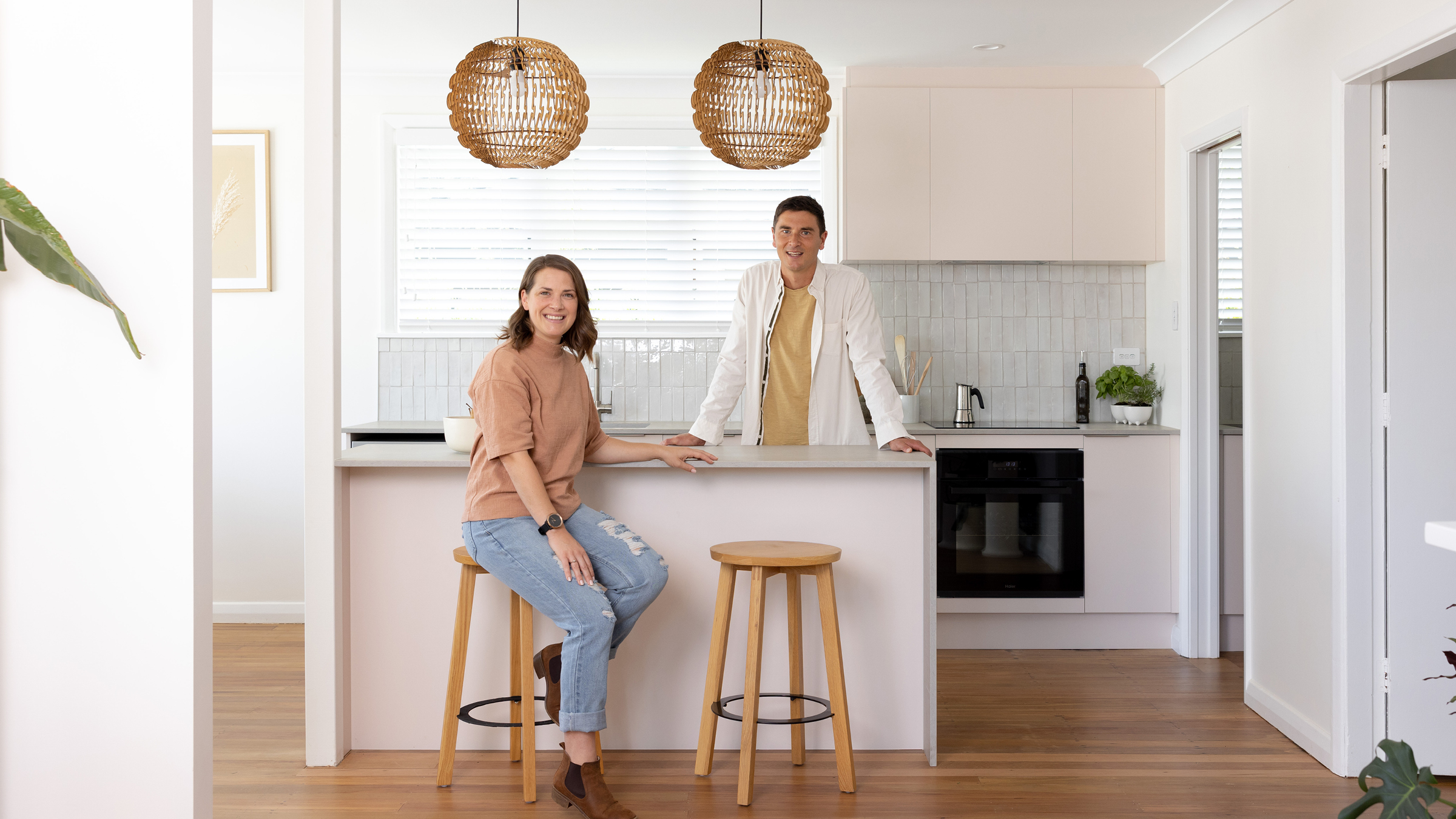 Alice and Caleb in their renovated kitchen